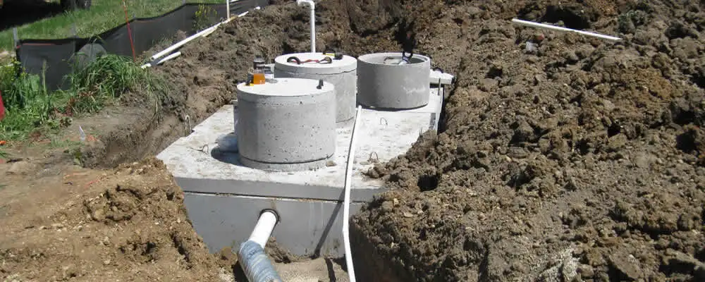 Septic system repair and installation site with tank access ports in Fort Wayne, IN