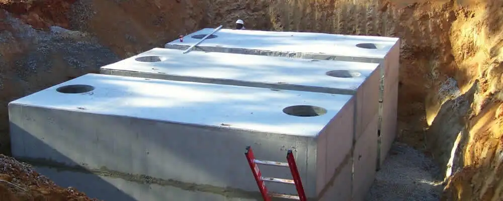Septic tank installation site with a newly placed concrete tank in Fort Wayne, IN